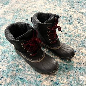 Sorel black winter lace up boots.